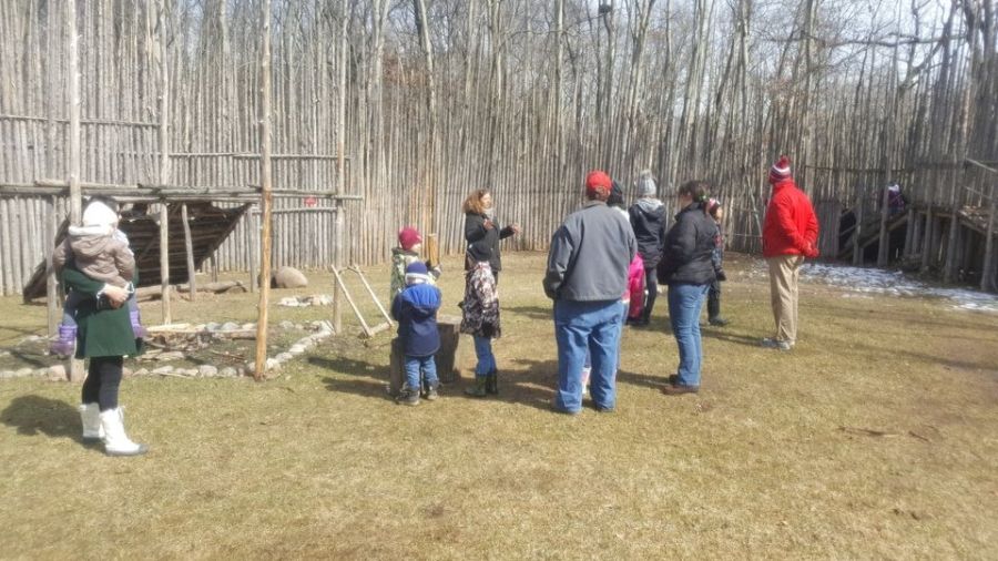 Parents and kids participating in activities during March Break at Longwoods Road Conservation Area