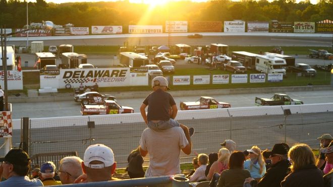 Crowd watching race cars