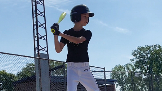 little boy playing baseball 