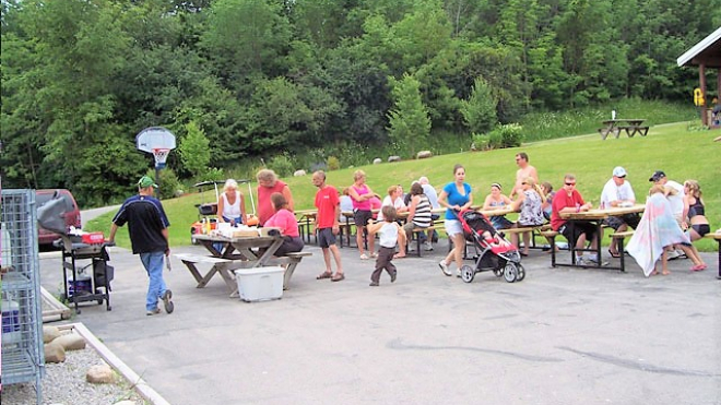 Group of people having a barbeque 