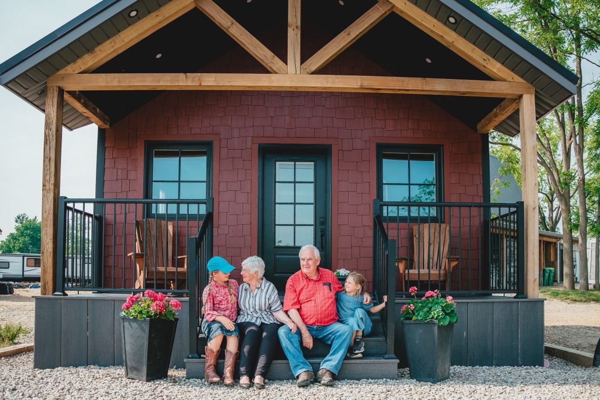 family on porch of accomodation