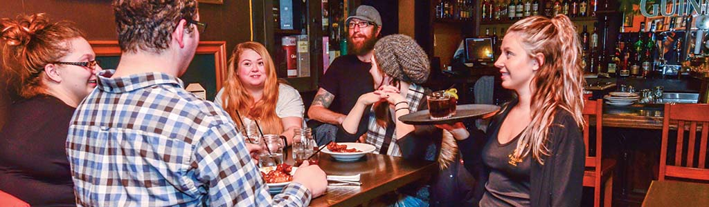 waitress serving a group of people