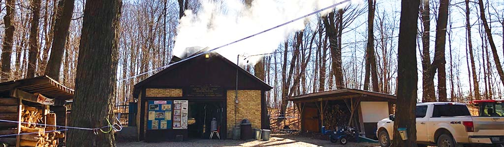 Sugar shack with smoke coming out 